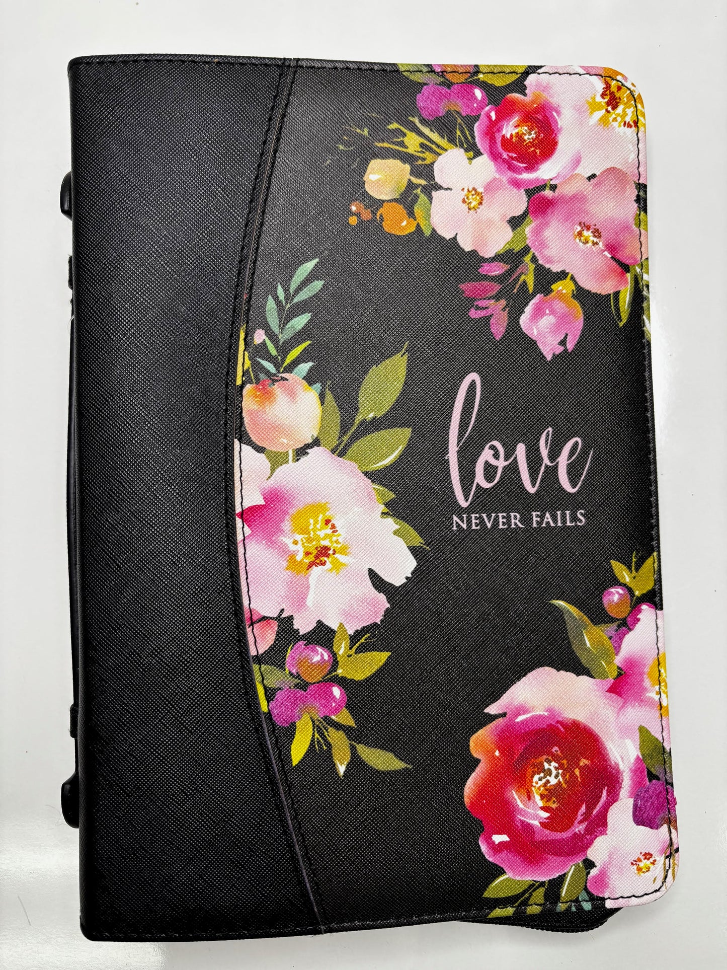 "Love Never Fails" Floral Bible Cover